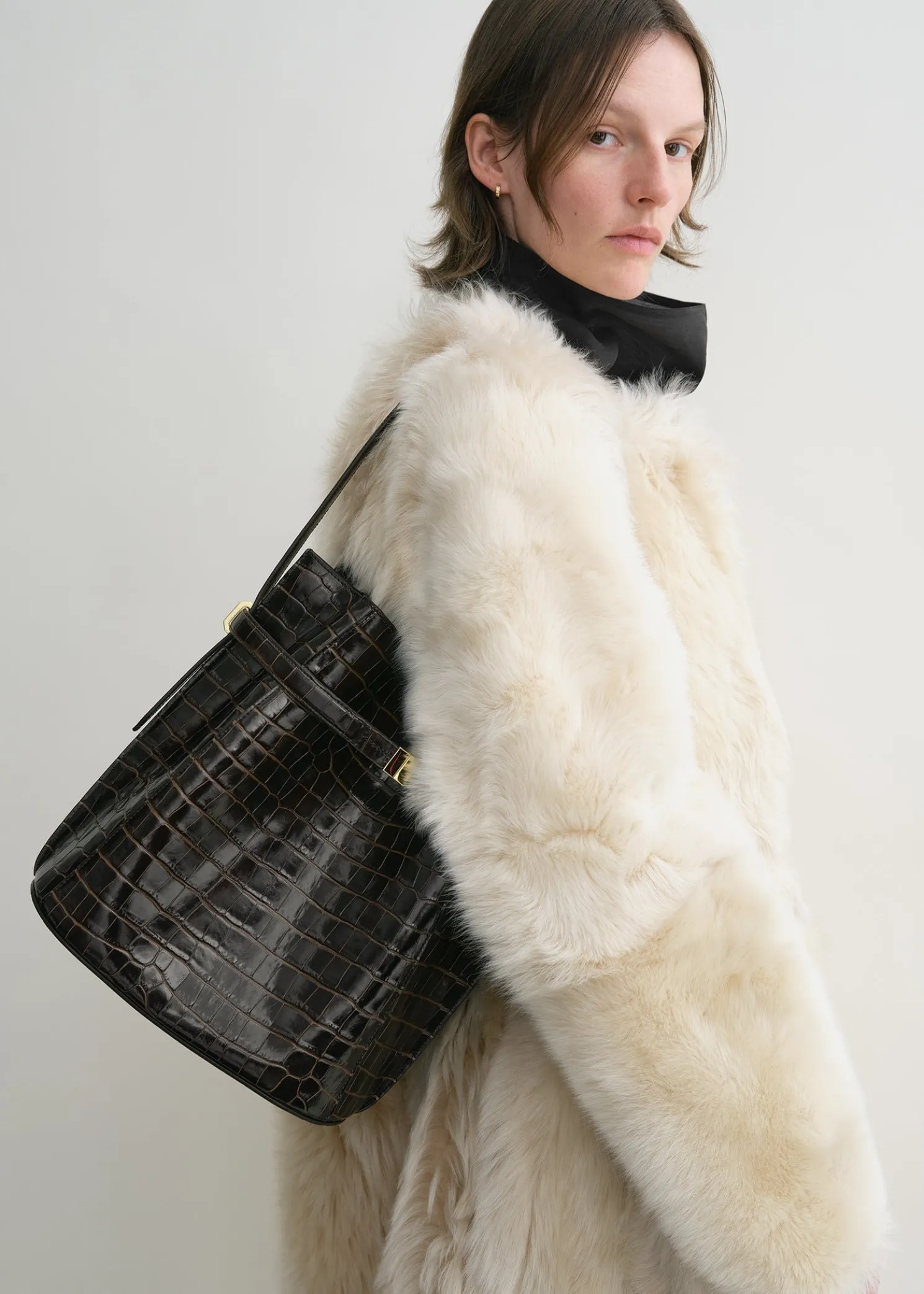 Belted croco-embossed bucket bag dark brown