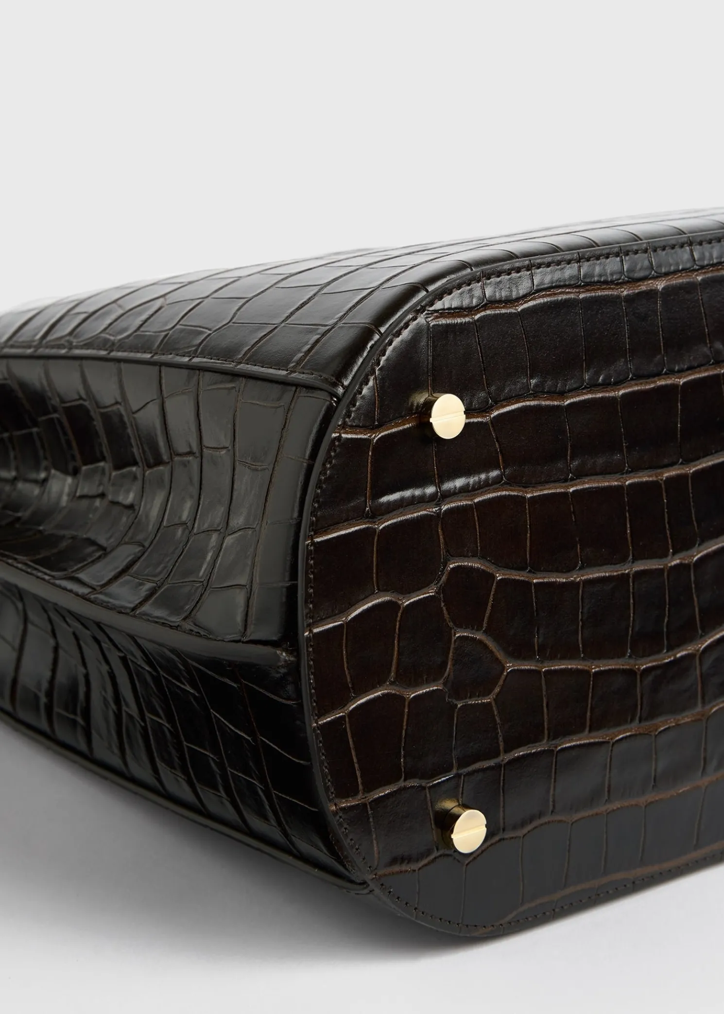 Belted croco-embossed bucket bag dark brown