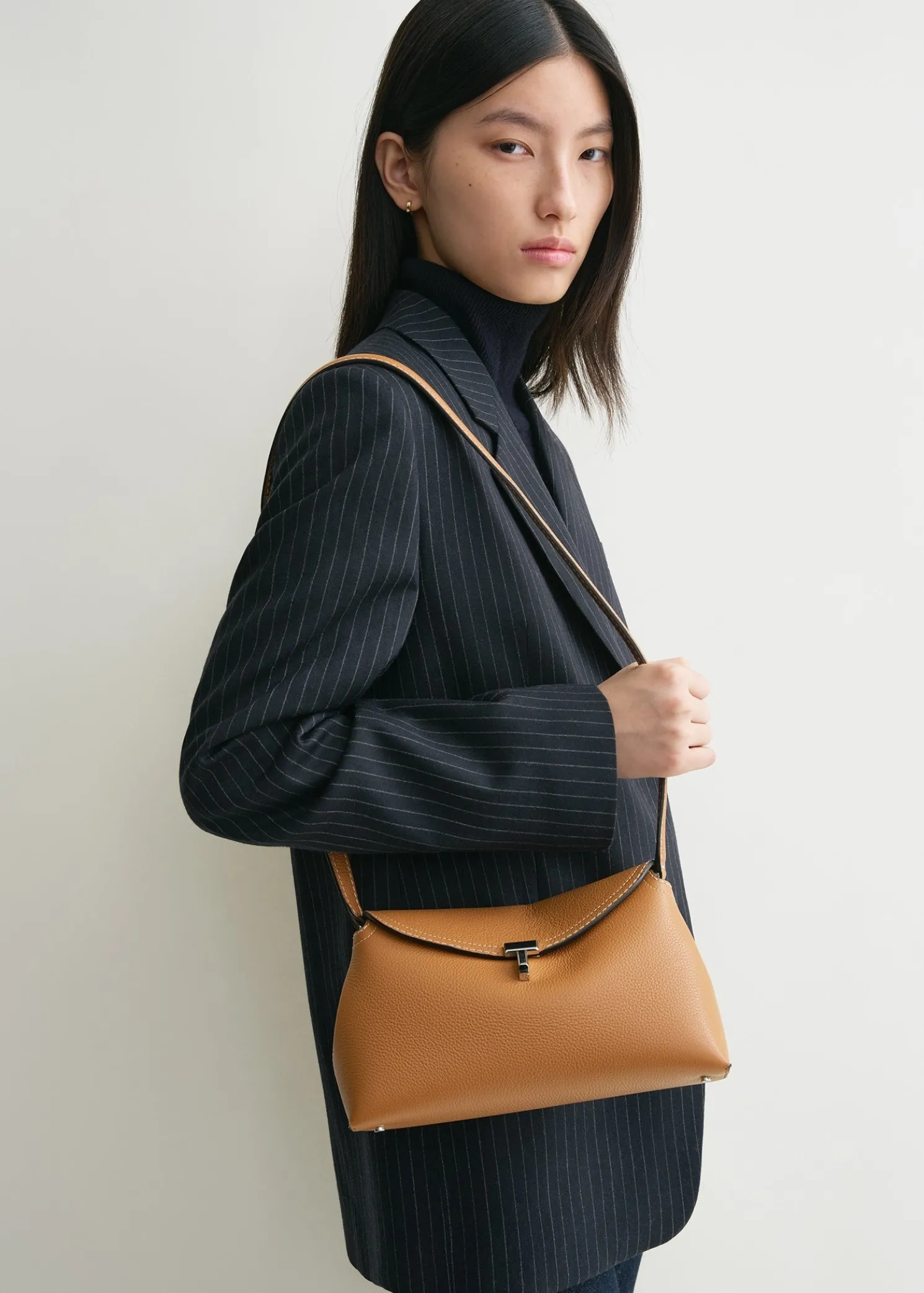 T-Lock grained-leather clutch tan