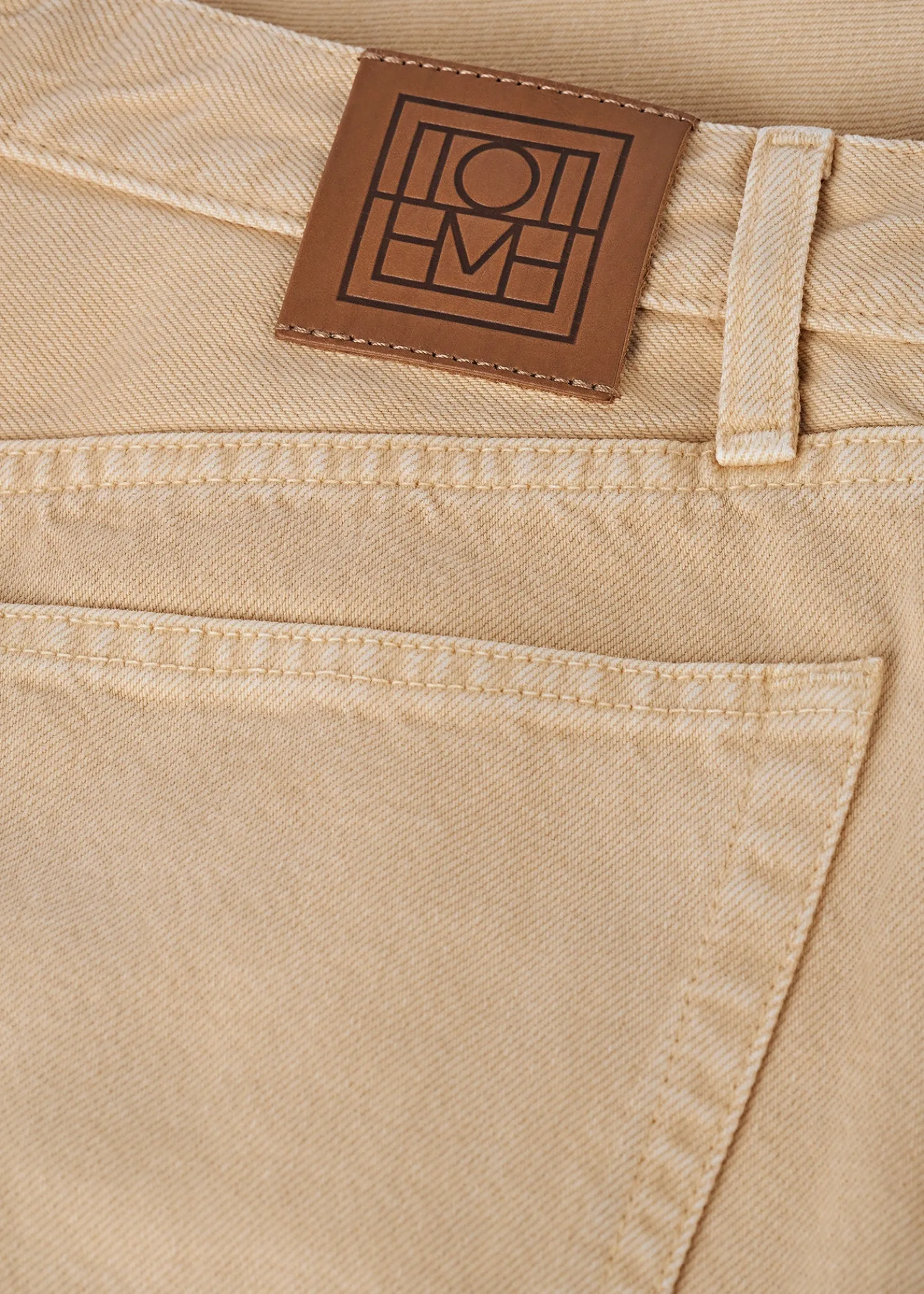 Twisted seam denim full length washed beige