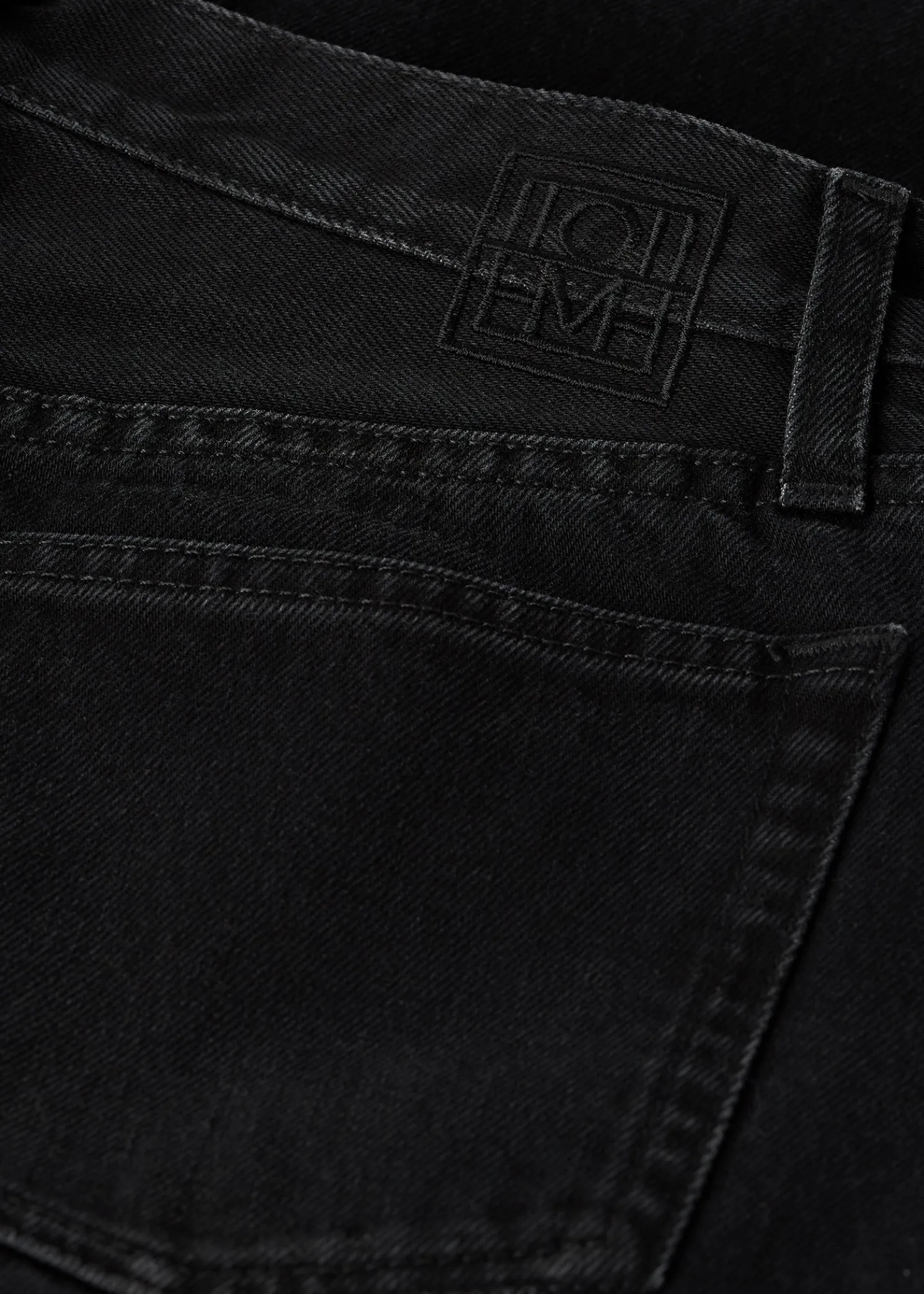 Twisted seam denim full length faded black