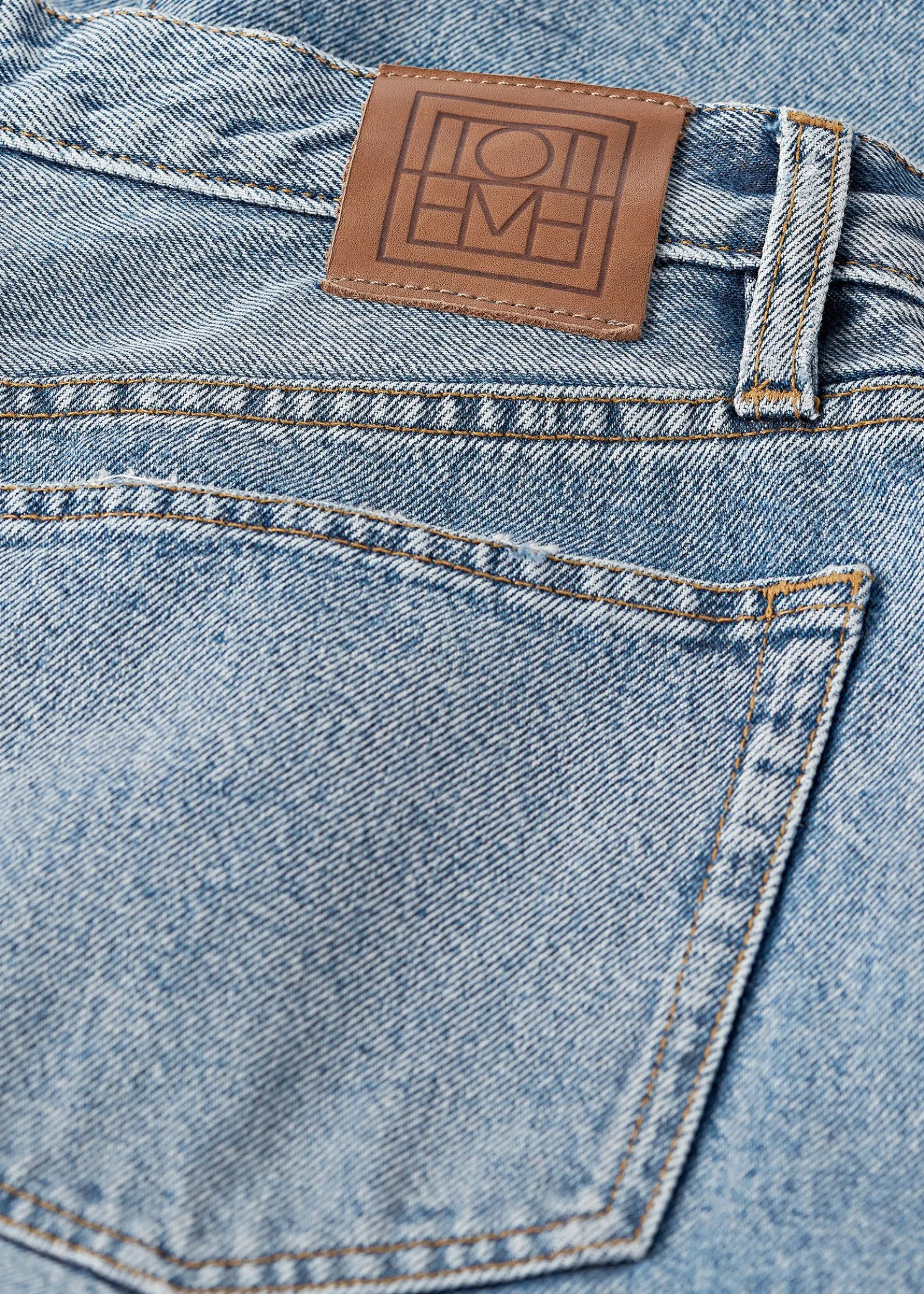 Twisted seam denim full length worn blue